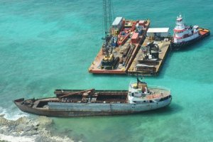 Response barges are anchored near the M/V Jireh. (USCG)